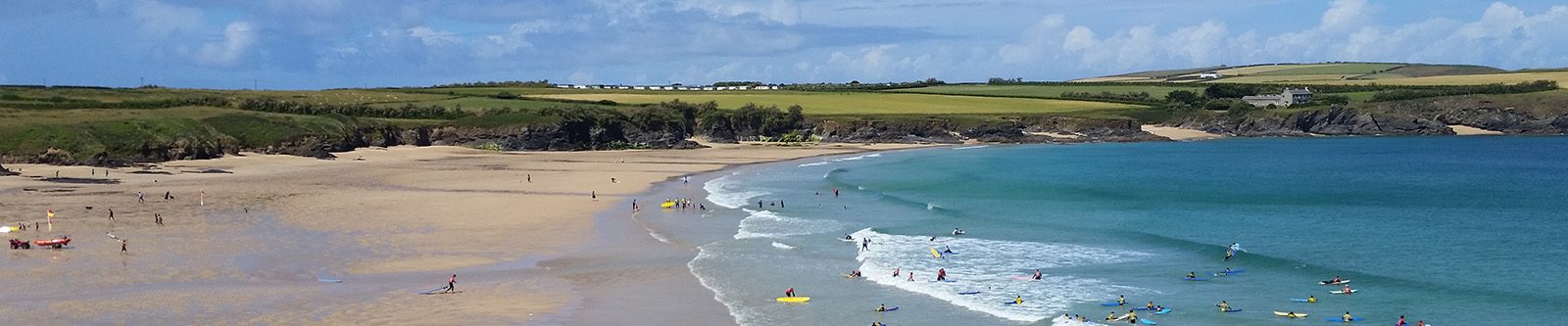 surfers at Harlyn bay