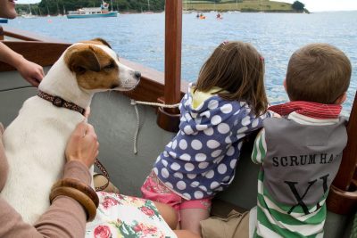 kids and dog on boat