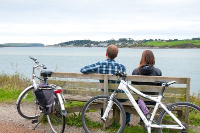 two people with bikes