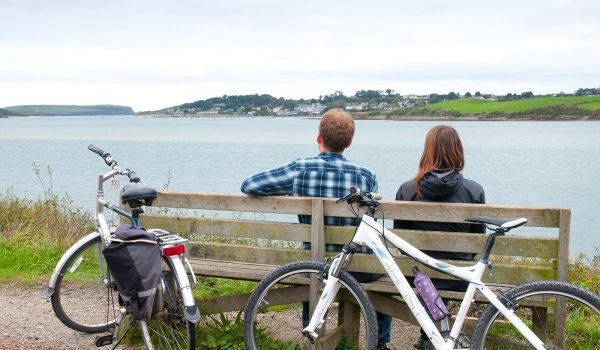 two people with bikes