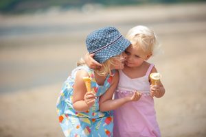 two little girls eating ice cream