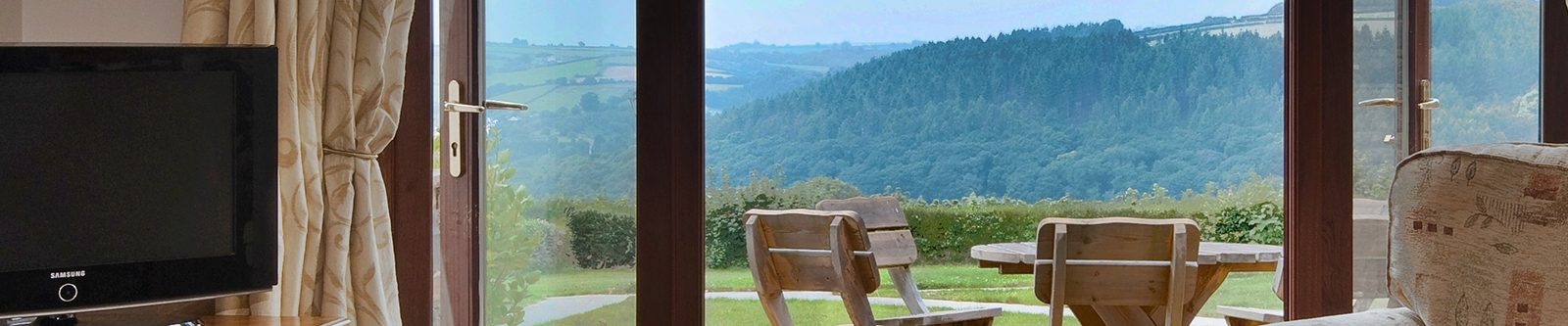 view from lounge - patio and the valley, from one of the cottages