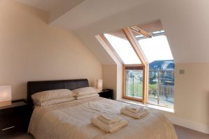 Interior of double bedroom with balcony