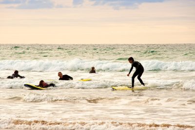 surfers at watergate bay