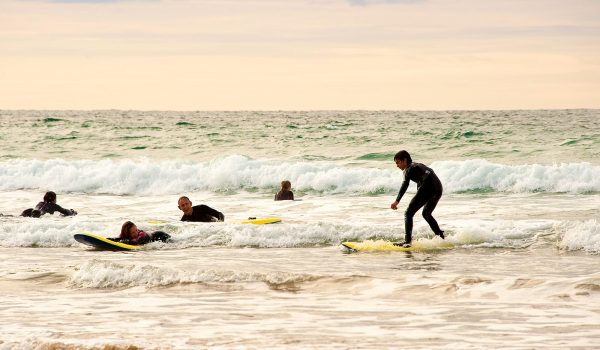 surfers at Watergate Bay
