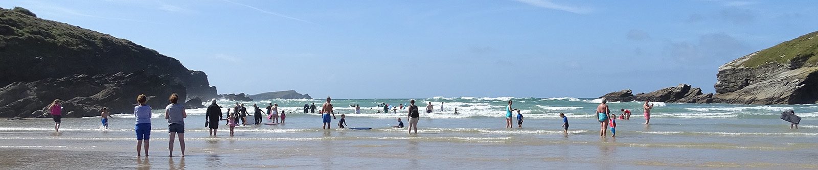 people at low tide at Porth beach