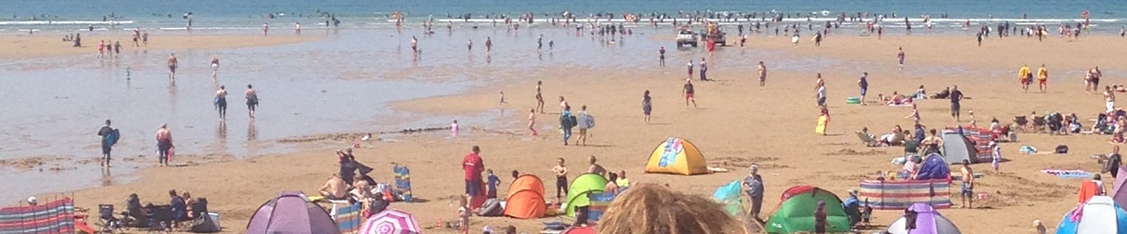 lifeguard watching watergate bay beach