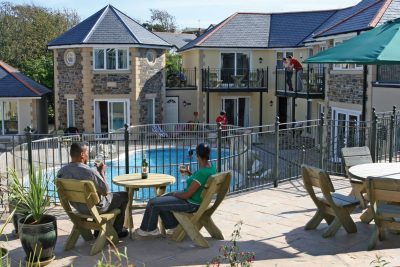 pool view with guests enjoying drinks