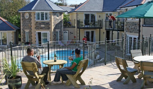 pool view with guests enjoying drinks