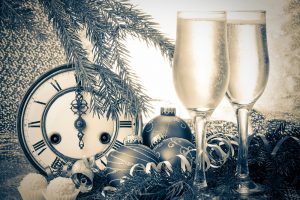 clock with baubles, truffles and wine glasses