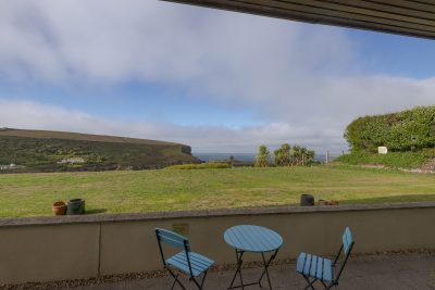 table and chairs with beach view