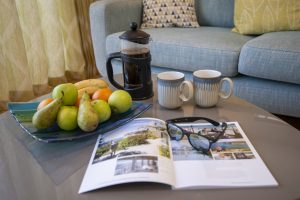 Fruit bowl, cafetière and magazine on the coffee table