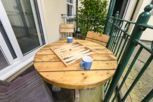 table and chairs on rear view balcony