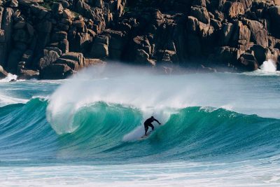 Surfer at Porthcurno