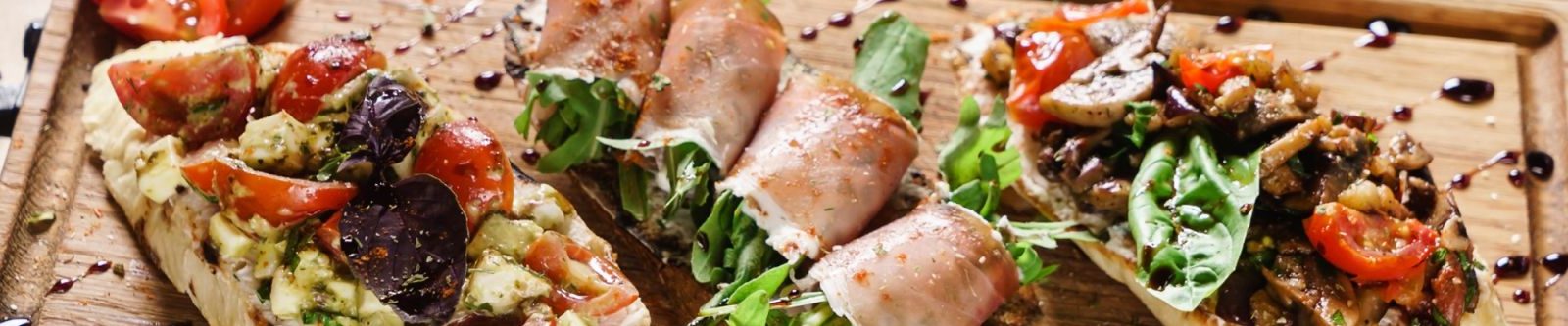 close up of food on a wooden tray