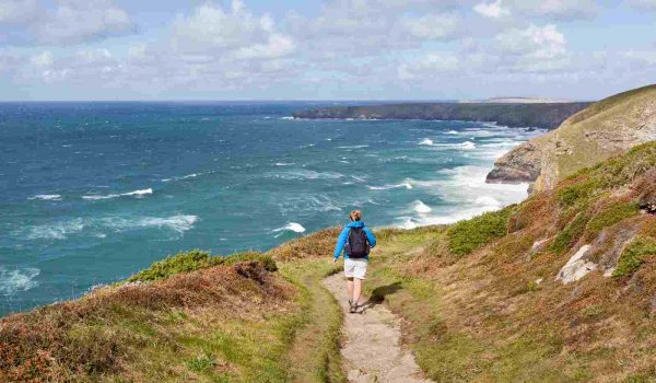 Woman walking on the South West Coast Path