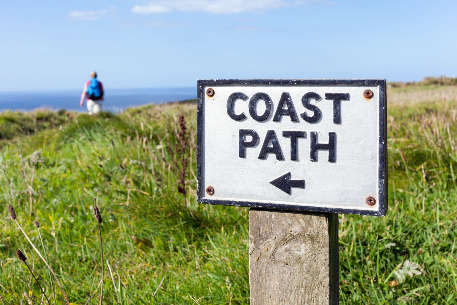 An old coast path sign on the Cornish cliffs near Tintagel