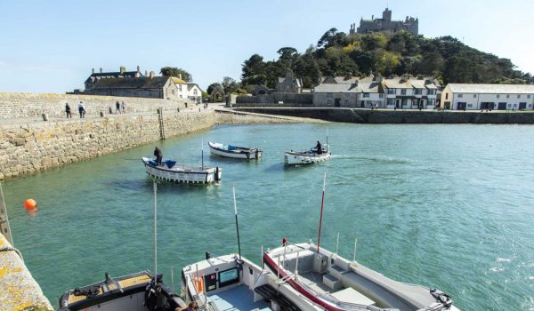 St Michaels Mount with boats in the harbour