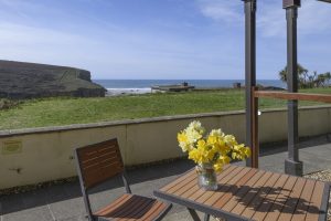 Table with flowers and sea view