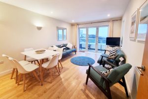 Living room, dining area and sea view