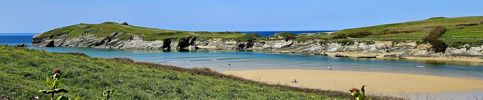 people at low tide at Porth beach