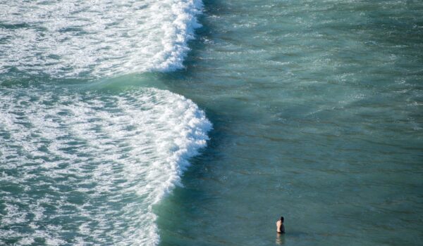 Tourist bathing near rip current